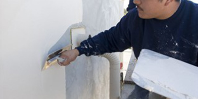 Smoothing out stucco wall