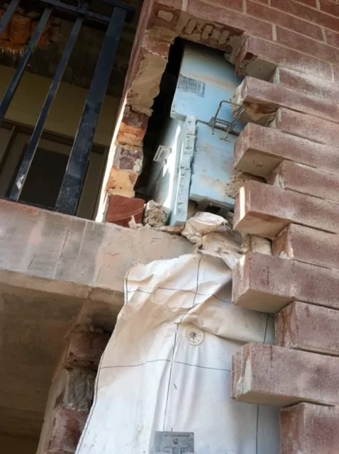 Before the exterior repairs were done on this masonry project. You can see the entire corner needs repaired.