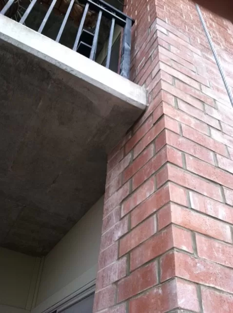 After exterior repairs were done on this masonry project.